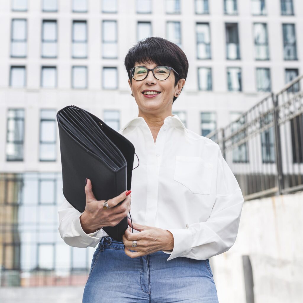 businesswoman-holding-map-smiles